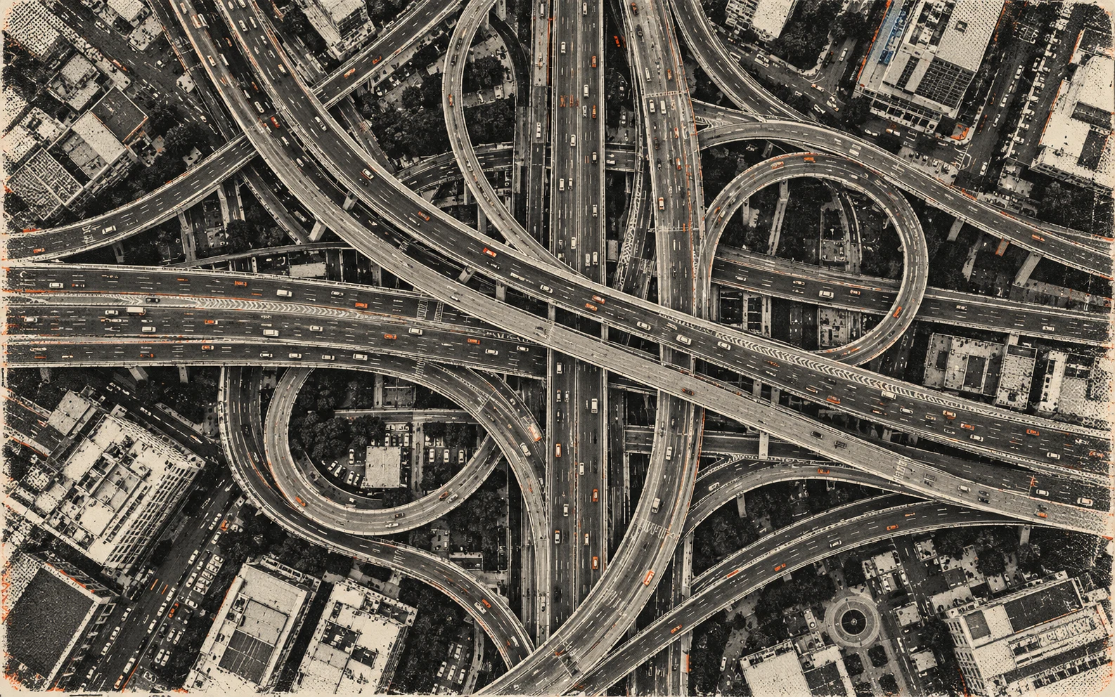 Black-and-white aerial view of a multi-level highway interchange